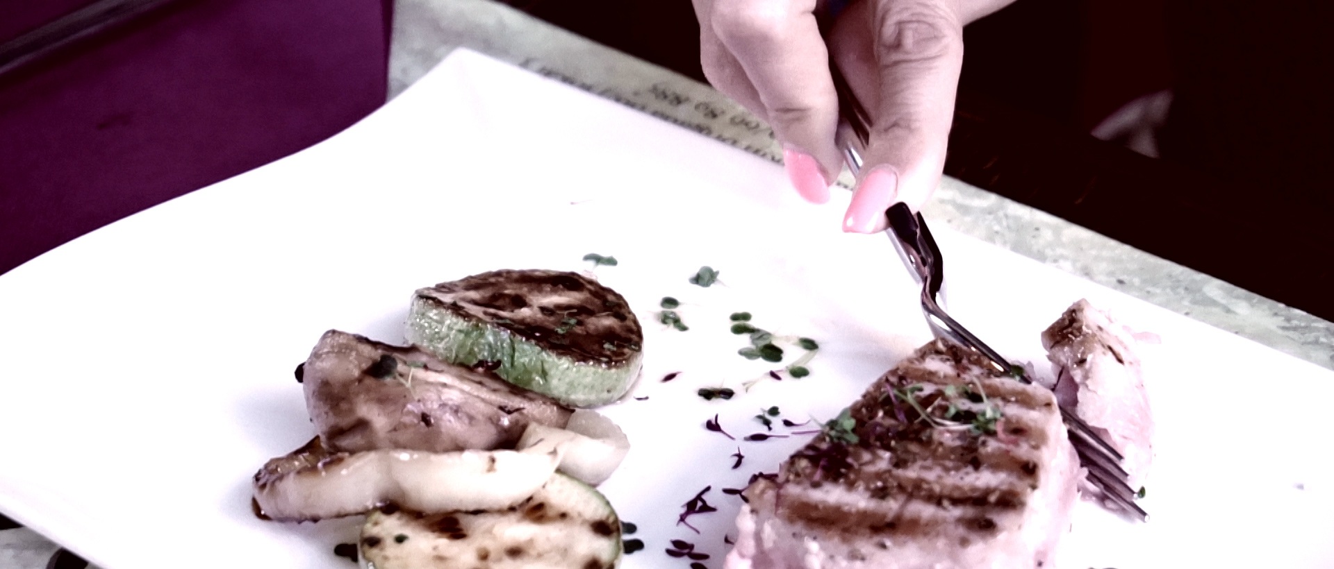 REZBOD adaptive cutlery in one-hand cutting configuration for upper-limb impairment